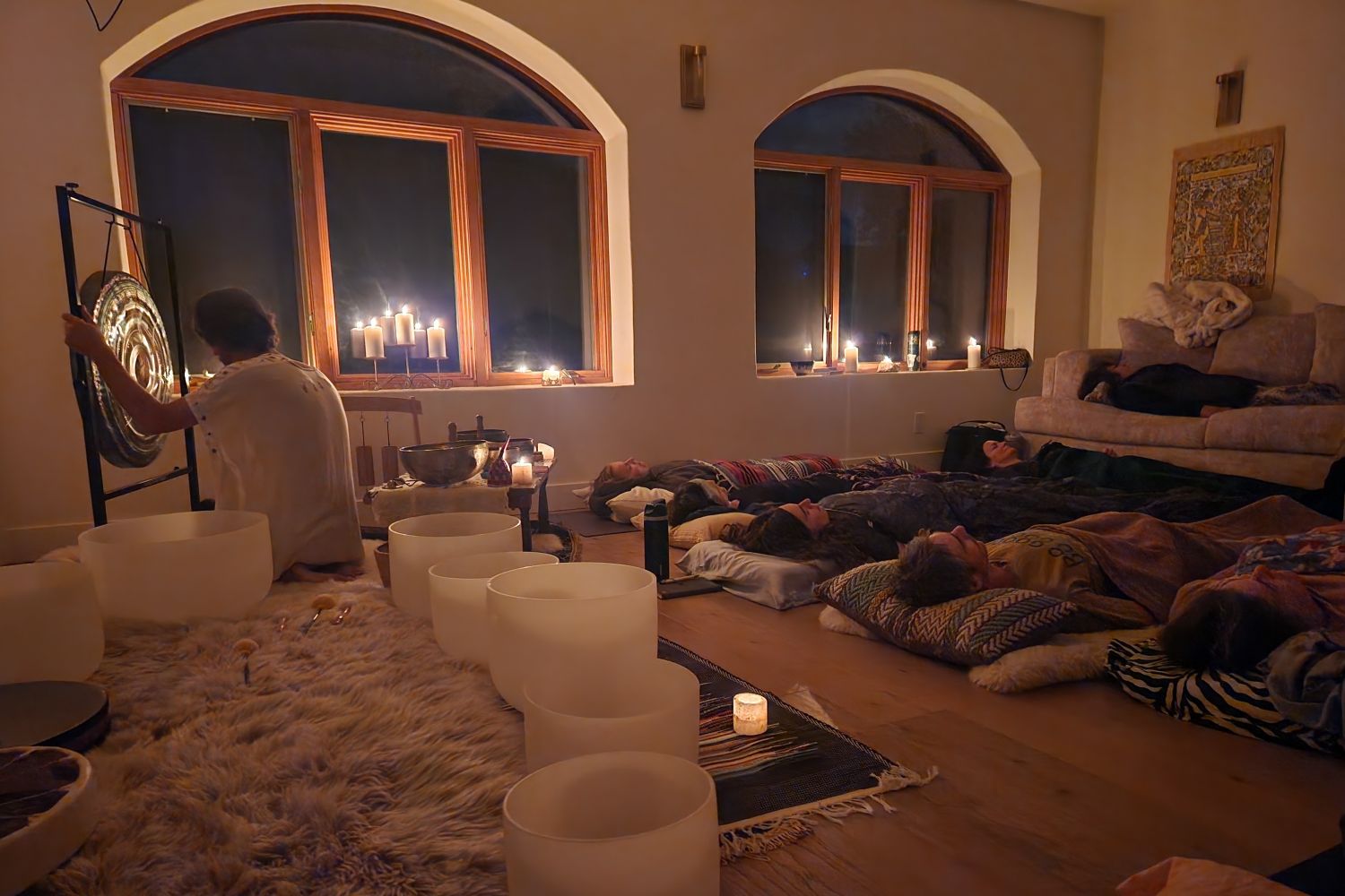 Interior gathering space arranged for sound healing.